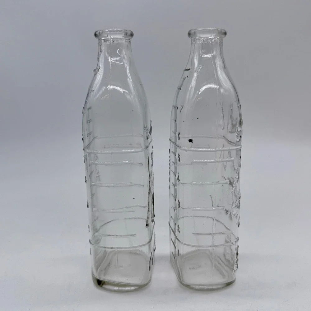 Vintage Embossed Glass Milk Bottle Dog and Rabbit Scene Set of 2